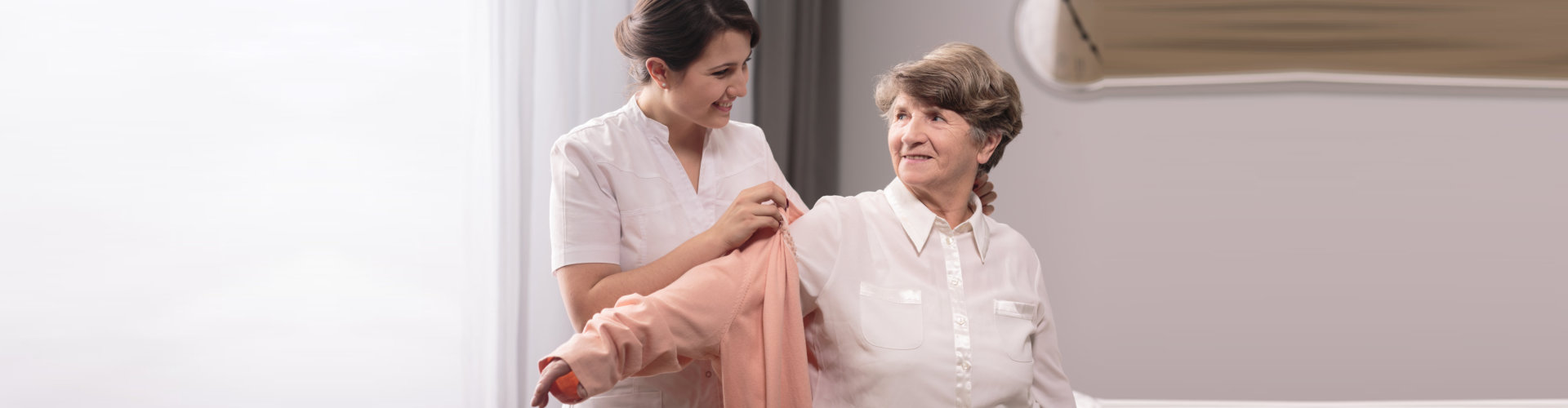 a caregiver woman assisting an elderly woman